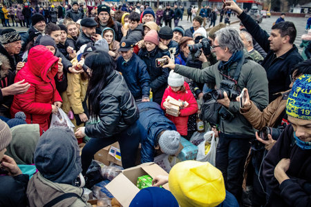 Kherson, Ukraine, November 20, 2022 Residents  receive food supplies in Freedom Square. The tension...