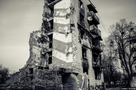 Borodyanka, Ukraine - March 14, 2023 Facade of a building having received artillery fire. Most...