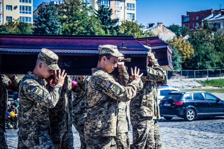 Lviv, Ukraine, August 29, 2024 Military ceremony at the Field of Mars, military cemetery of Lviv,...