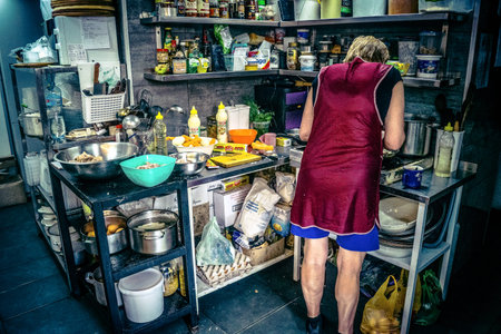 Kharkiv, Ukraine, June 06, 2025 Volunteers from the Palyanica charity organization cook homemade...