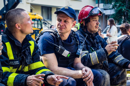 Kharkiv, Ukraine, June 7, 2025 Firefighters are resting after a Russian attack on a residential...