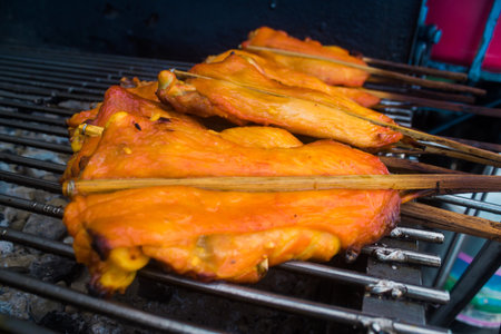 Bangkok, Thailand, March 12, 2025 Meat food cart, Thai street food is a market where vendors set up stalls to sell food and people buy it to enjoy on the go or directly from nearby tables.