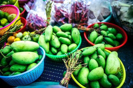 Bangkok, Thailand, March 12, 2025. A street vegetable market in Bangkok. Fresh markets are sprawling...
