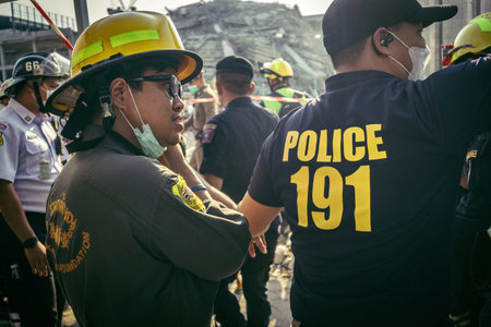 Bangkok, Thailand, March 28, 2025. Police assist rescuers in Bangkok at the site of a high-rise...