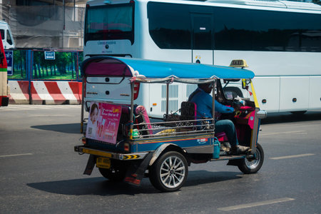 Bangkok, Thailand, March 06, 2025 Tuk Tuk rolling in the streets of Bangkok, capital of Thailand....
