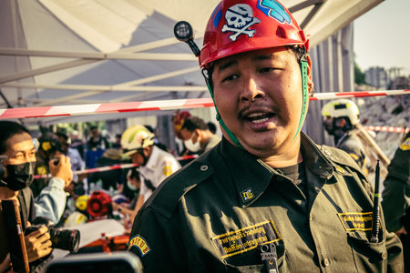 Bangkok, Thailand, March 28, 2025 Rescuers in Bangkok are at the site of a high-rise building under construction that collapsed after the earthquake struck the Thai capital.のeditorial素材