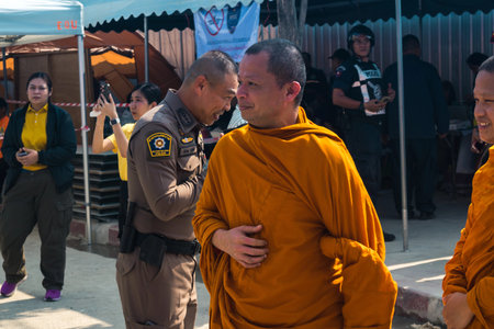 Bangkok, Thailand, March 29, 2025 Buddhist monks come to pray for victims at the site of a high-rise...