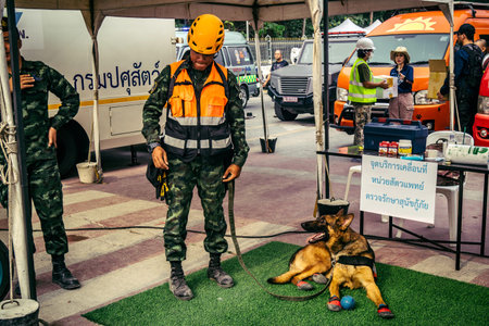 Bangkok, Thailand, April 02, 2025 Rescuers work at the site of a high-rise building under...