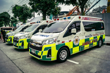 Bangkok, Thailand, April 02, 2025 Ambulances are at the site of a building under construction that...