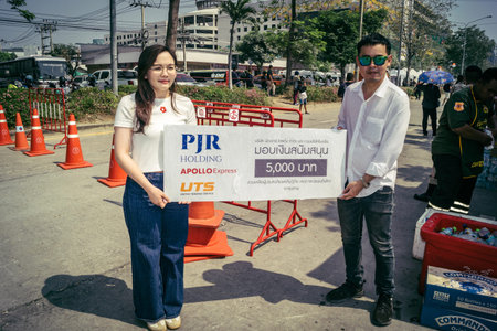 Bangkok, Thailand, March 29, 2025. Volunteers set up tents and distribute water and food to rescuers...