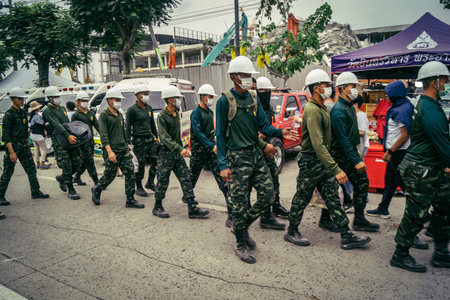 Bangkok, Thailand, March 31, 2025 Rescuers work at the site of a high-rise building under...