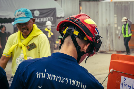 Bangkok, Thailand, March 31, 2025 Rescuers work at the site of a high-rise building under...