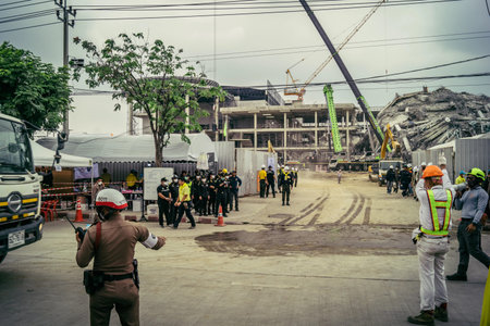 Bangkok, Thailand, March 31, 2025 Rescuers work at the site of a high-rise building under...