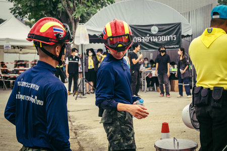 Bangkok, Thailand, March 31, 2025 Rescuers work at the site of a high-rise building under...