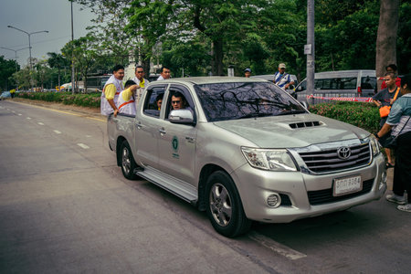 Bangkok, Thailand, March 31, 2025 Police cars are deployed to the site of a collapsed building after...