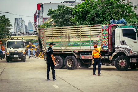 Bangkok, Thailand, March 31, 2025 Construction vehicles are being used at the site of a building...