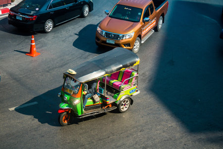 Bangkok, Thailand, March 06, 2025 Tuk Tuk rolling in the streets of Bangkok, capital of Thailand....