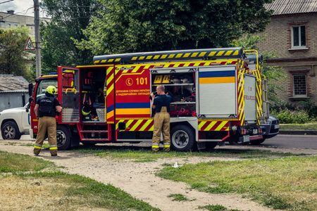 Kharkiv, Ukraine, June 11, 2025 Firefighters are responding to a residential building in Kharkiv...