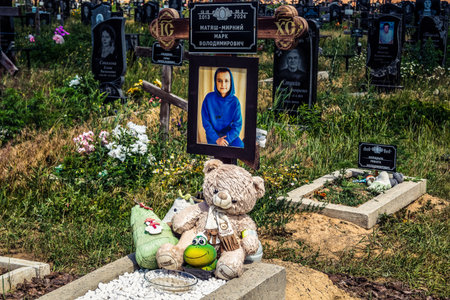 Kharkiv, Ukraine, July 3, 2025 The cemetery contains many graves of children killed in bombing raids...