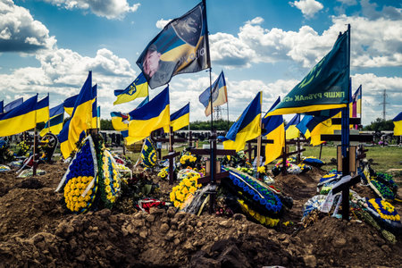 Kharkiv, Ukraine, July 3, 2025 Yellow and blue flags flutter as far as the eye can see at Aleya...