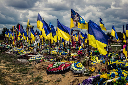 Kharkiv, Ukraine, July 3, 2025 Yellow and blue flags flutter as far as the eye can see at Aleya...