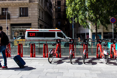 Barcelona, Spain - August 28, 2023 Ambulance driving in the city center of Barcelona, an emblematic...