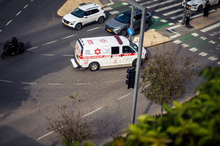 Tel Aviv, Israel, January 21, 2026 Magen David Adom (MDA) ambulance driving with emergency lights...