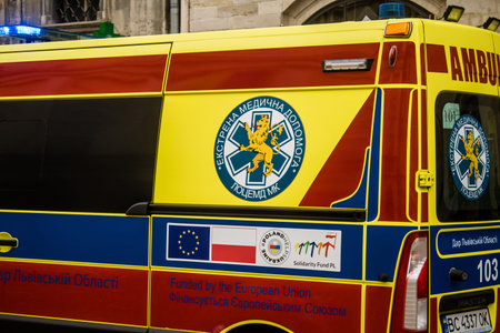 Lviv, Ukraine, August 27, 2024 Ambulance runs through downtown Lviv during the war with Russia. Lviv...