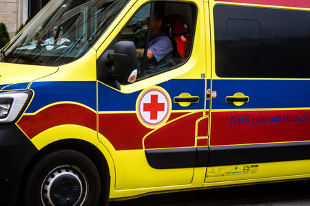 Lviv, Ukraine, August 27, 2024 Ambulance runs through downtown Lviv during the war with Russia. Lviv...