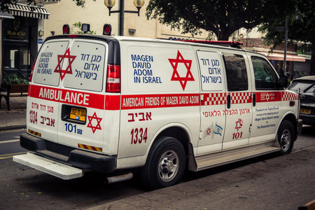 Tel Aviv, Israel, March 14, 2026 An ambulance is parked on a city street as a dense Sharav sandstorm...