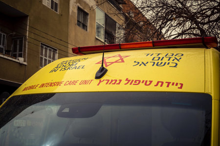Tel Aviv, Israel, March 14, 2026 An ambulance is parked on a city street as a dense Sharav sandstorm...