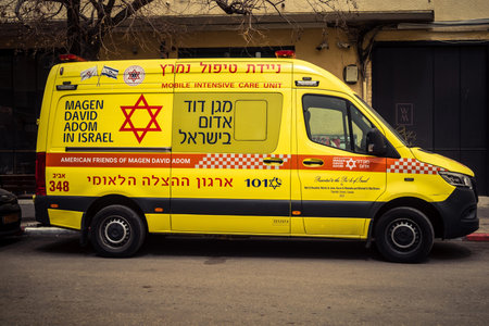 Tel Aviv, Israel, March 14, 2026 An ambulance is parked on a city street as a dense Sharav sandstorm...