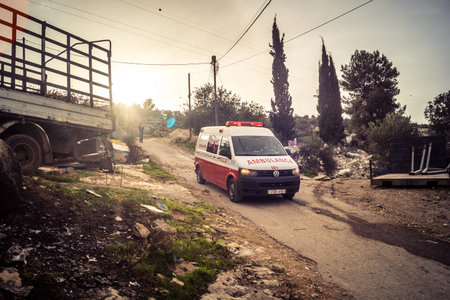 Tarqiyah, West Bank, February 1, 2026: An ambulance on-site treating Palestinian residents for tear...