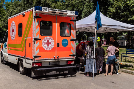 Kharkiv, Ukraine, July 6, 2025 Ambulance is parked at the site of a Russian attack on a residential...