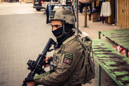 Hebron, West Bank, Palestine. February 14, 2026 Military surveillance and IDF soldiers protecting settlers in a sensitive zone. Defense and security operations in the streets of Hebron old city.