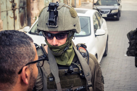 Hebron, West Bank, Palestine. February 14, 2026 Israeli soldiers escort and protect settlers. An army patrol maintains security and order in the heart of the old Palestinian city of Hebron.