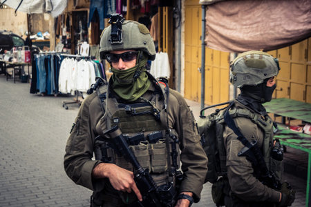 Hebron, West Bank, Palestine. February 14, 2026 Israeli soldiers escort and protect settlers. An army patrol maintains security and order in the heart of the old Palestinian city of Hebron.
