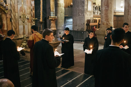 Jerusalem, Israel â€“ December 24, 2023 Armenian mass at the Church of the Holy Sepulcher, also known as the Church of the Resurrection, located in the Christian Quarter of the Old City of Jerusalem.
