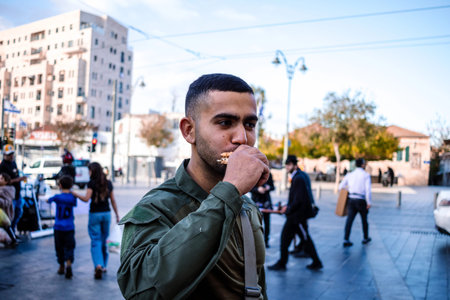 Jerusalem, Israel - December 22, 2023 Soldiers at the Mahane Yehuda Market, often called "the Shuk",a market in Jerusalem. Soldiers protect the market from terrorist attacks