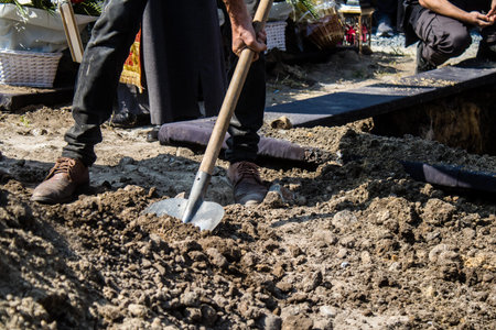 Lviv, Ukraine, August 31, 2024 Burial by gravediggers at the Field of Mars, military cemetery of Lviv, of an Azo soldier who died in a battle against the Russian army.