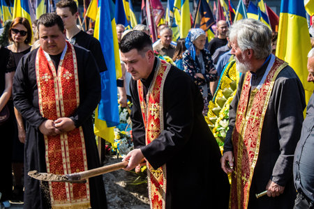 Lviv, Ukraine, August 31, 2024 Family and friends at the Field of Mars at the Lviv military cemetery attend the burial of an Azov soldier who died in a battle with the Russian army.