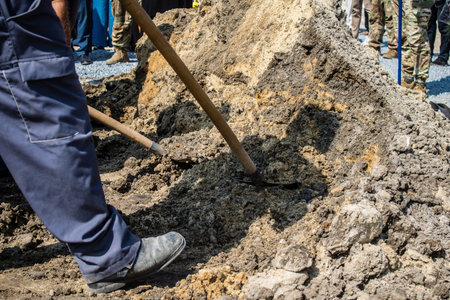 Lviv, Ukraine, August 31, 2024 Burial by gravediggers at the Field of Mars, military cemetery of Lviv, of an Azo soldier who died in a battle against the Russian army.