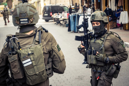 Hebron, West Bank, Palestine. February 14, 2026 Israeli soldiers escort and protect settlers. An army patrol maintains security and order in the heart of the old Palestinian city of Hebron.