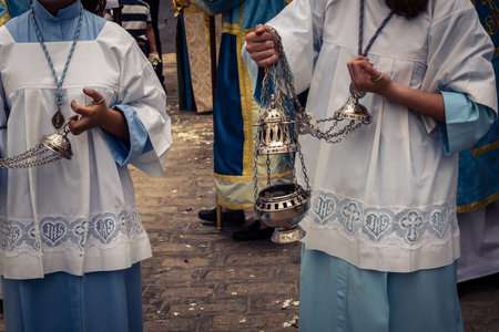 Carmona, Andalusia, Spain, May 24, 2026. A group of young participants, dressed in ceremonial attire, leads the procession of the Virgen de Gracia. They carry censers, their steady pace and concentrated expressions marking the beginning of this important 