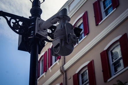Gibraltar, British Overseas Territory, September 23 2026 Security camera mounted on a building facade for urban surveillance along the pedestrian Main Street in the historic town center