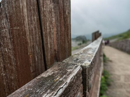 Weary wood fence. It is in the country, on a really cloudy, misty day.の写真素材