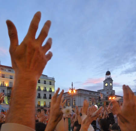 Madrid, Spain; May 27 2011. Hands up in the air at the 15-M protest demonstrations in Madrid's Puerta del Sol. Photography taken on May 27 2011 in Madrid, Spainのeditorial素材