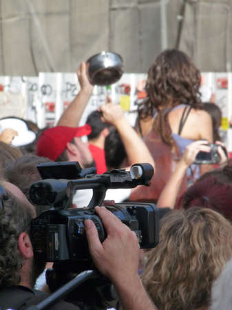 Madrid, Spain; June 11 2011. People hitting a construction site barrier in protest. 15-M Outraged protests at Puerta del Sol in Madrid. Photography taken on June 11 2011 in Madrid, Spainのeditorial素材