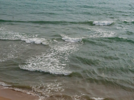 Detail of waves in a seascape on a cloudy day in Valencia, Spainの写真素材
