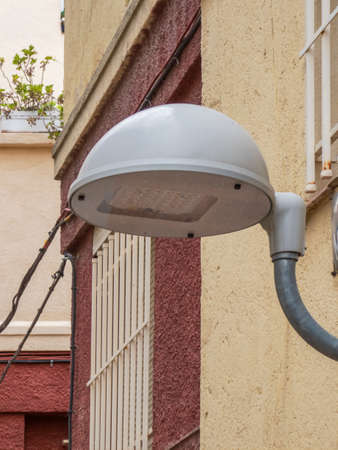 Modern led streetlight installed in an old style Spanish neighborhoodの写真素材
